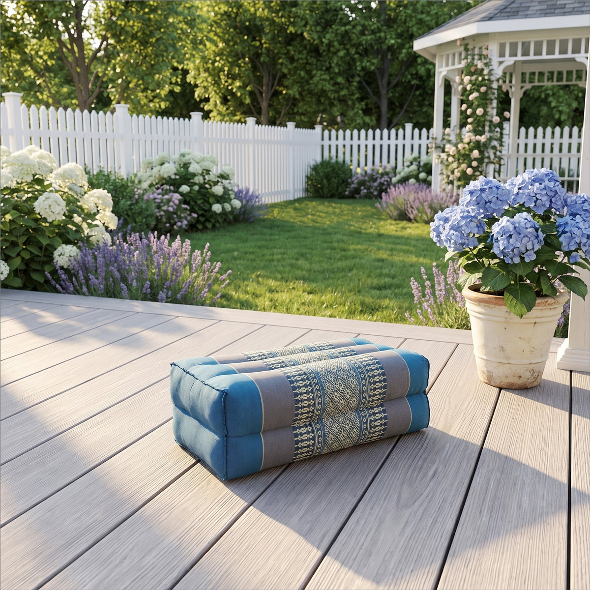 Blue yoga block on a sunlit garden deck