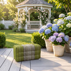 Green yoga block beside hydrangeas on a garden deck