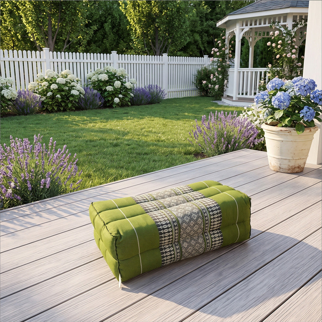 Green yoga block on a sunlit garden deck