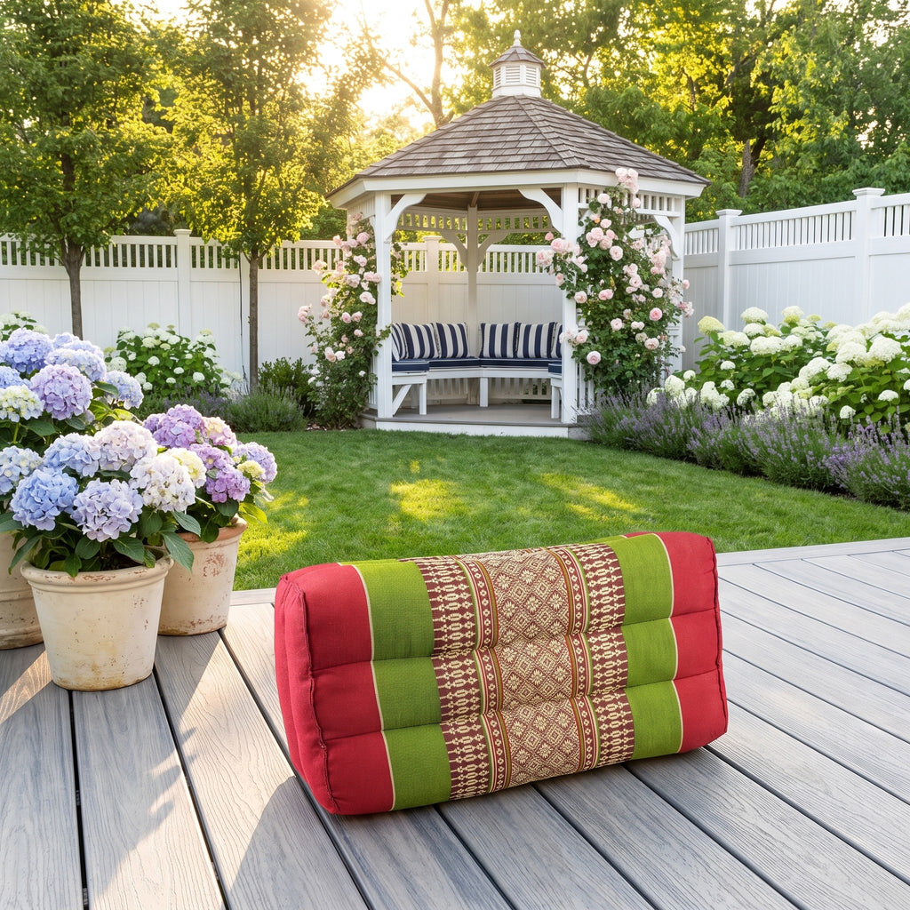 Red and green Thai kapok yoga block on a Hamptons garden deck
