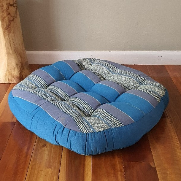 Blue jumbo round Thai kapok meditation cushion, low side view
