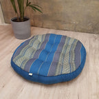 Blue jumbo round Thai kapok meditation cushion, angled front view