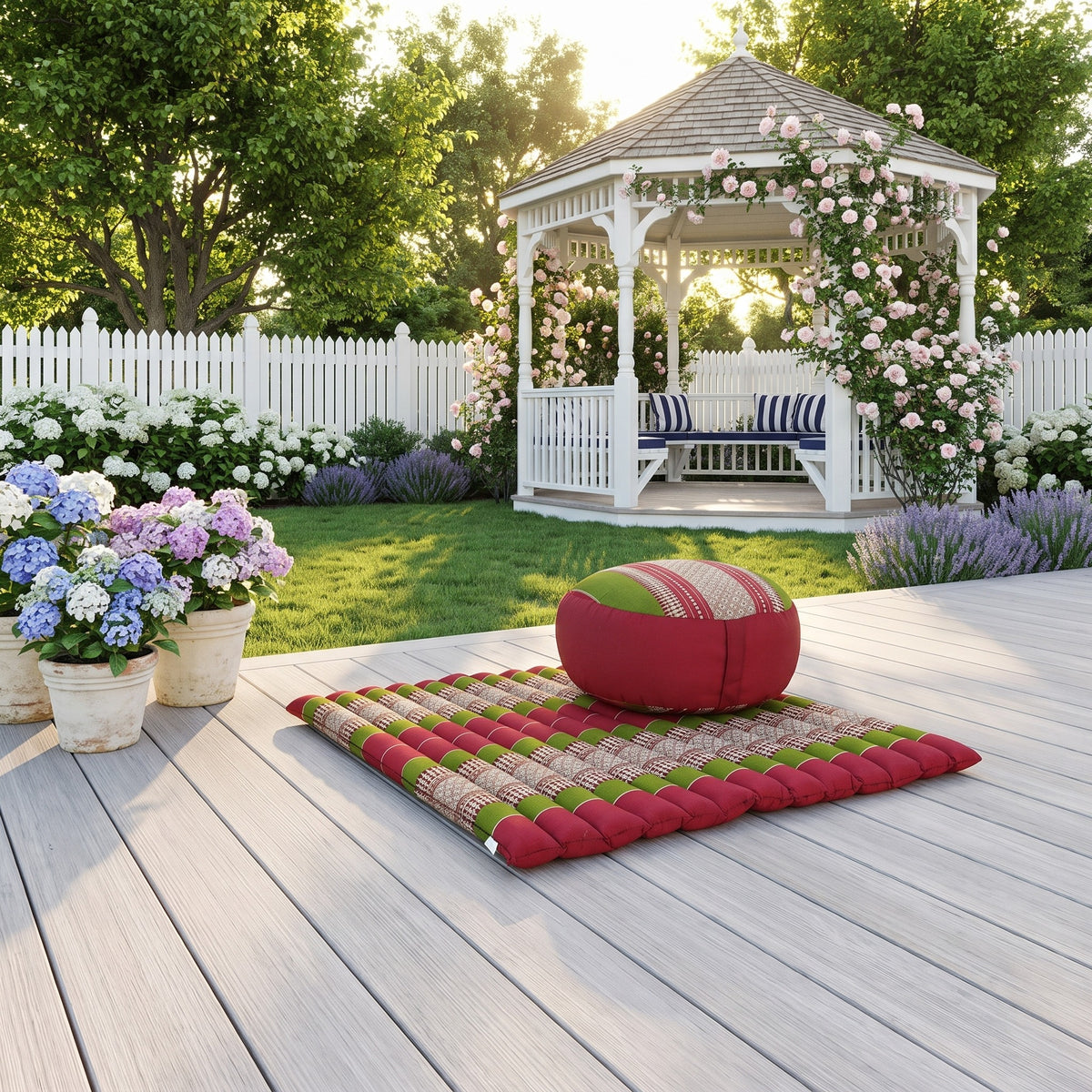 Red and green foldable Zafu and Zabuton meditation cushion set on a garden deck